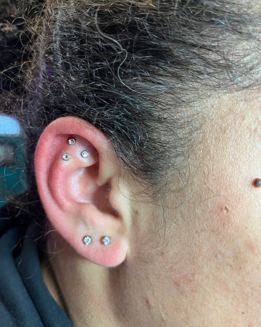 Triple helix ear piercing by Wicked Inx